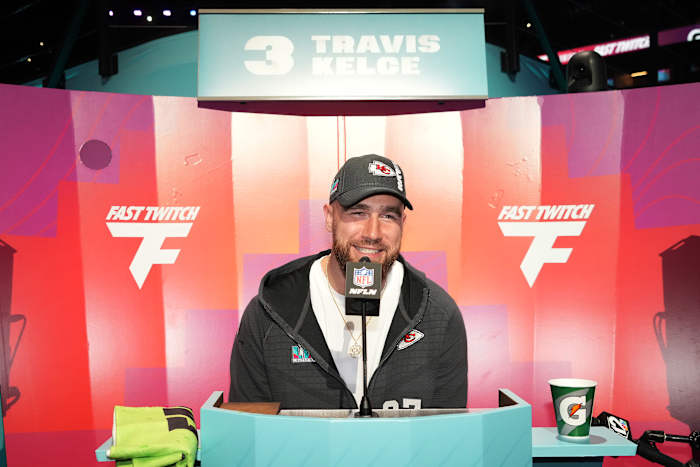 Feb 6, 2023; Phoenix, AZ, USA; Kansas City Chiefs tight end Travis Kelce (87) speaks with media during Super Bowl Opening Night at Footprint Center. Mandatory Credit: Kirby Lee-USA TODAY Sports